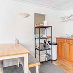 dining table next to a kitchen