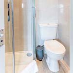 toilet next to a shower